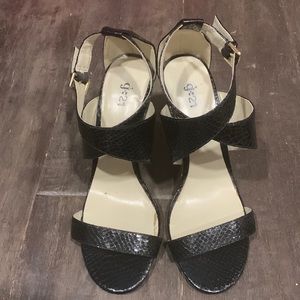 Shiny black summer sandal heels.